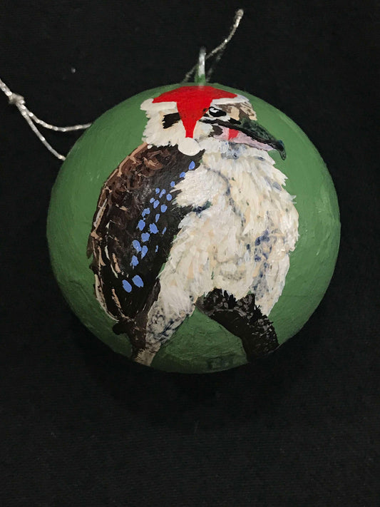 Hand-painted Christmas ornament featuring a kookaburra on a green bauble.